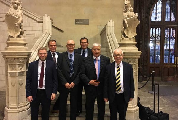 A colour photo fo Dudley Chapman of Forecast Technology and representatives of Airbus and the National Oceanographic Centre