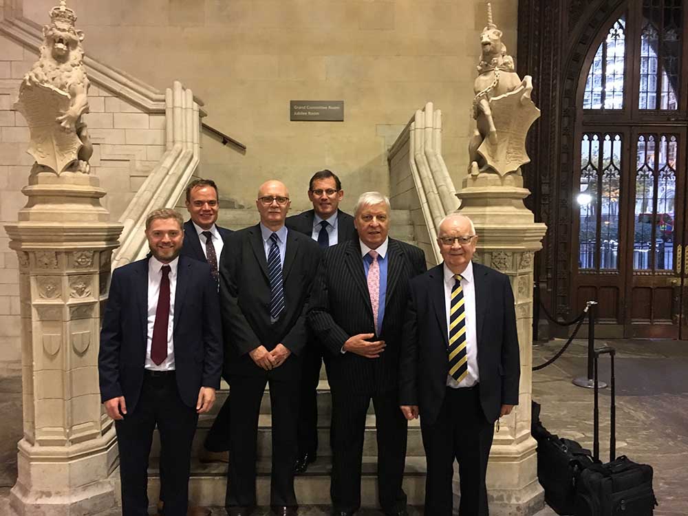 A colour photo fo Dudley Chapman of Forecast Technology and representatives of Airbus and the National Oceanographic Centre